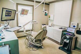 an examination room with dental equipment